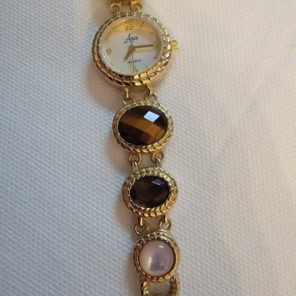 Aria Goldtone bracelet watch with tiger eye, smoky quartz and milky quartz gems - Picture 1 of 8